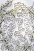 multiple ceramic bubble palettes arranged together against white background with flowers 