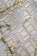 Rectangular watercolor palettes arranged side by side on a white background with flowers 