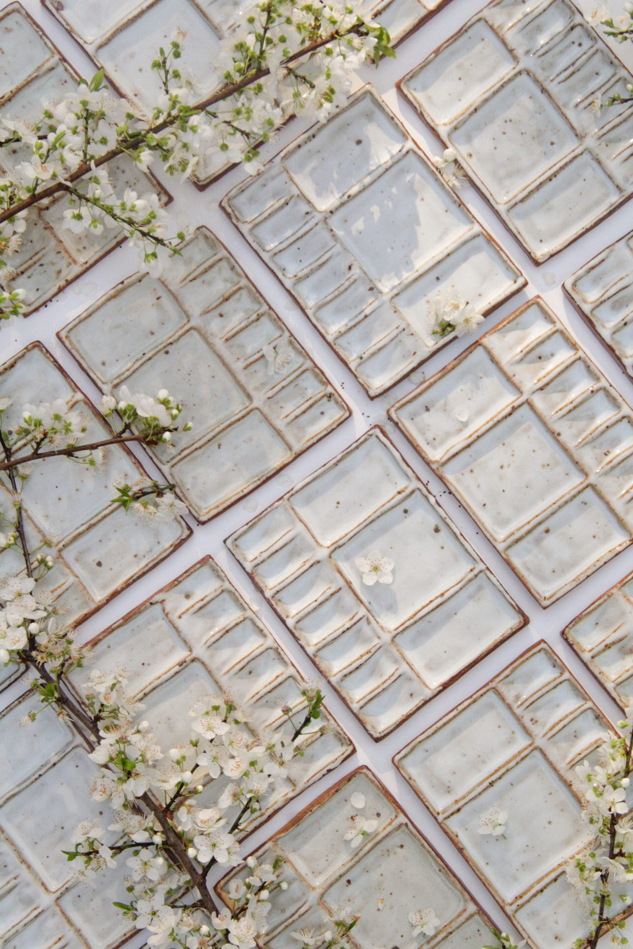 Rectangular watercolor palettes arranged side by side on a white background with flowers 